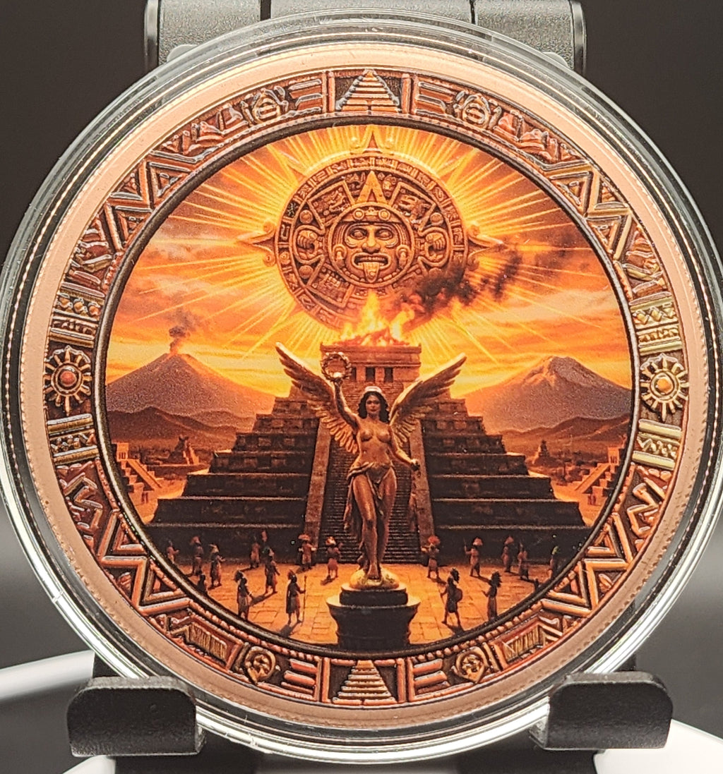 A round watch face featuring an intricate, detailed Mexican Aztec calendar and sun illustration in warm orange, brown, and gold tones, housed in a silver-toned metal case.
